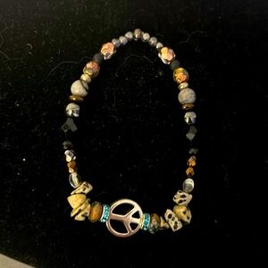 Funky stone bracelet wi silver peace sign.